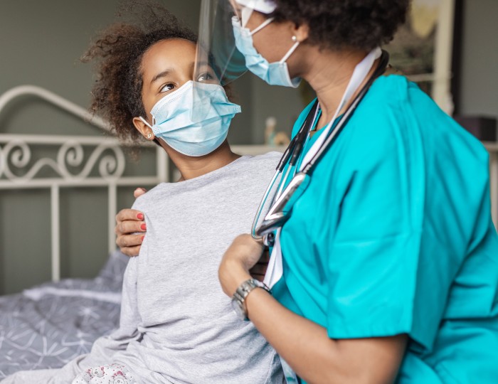 Doctor consoling girl