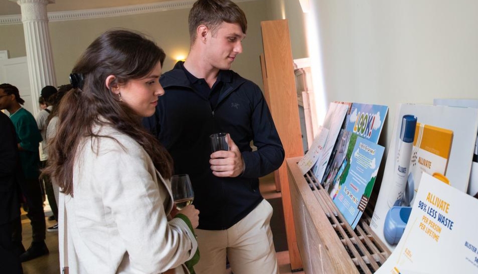 Students reviewing entries to the Design for Life Awards