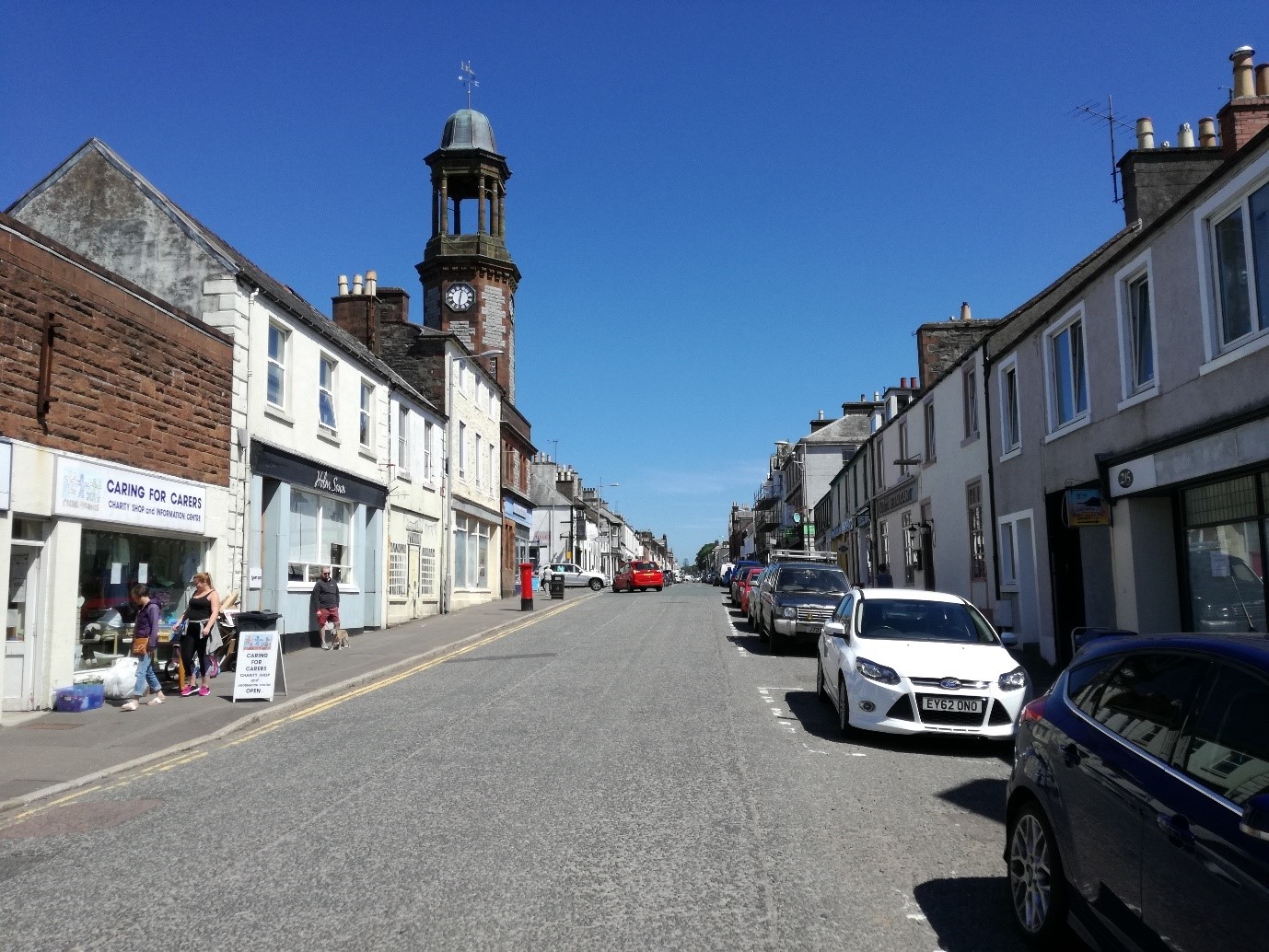 Photo of a sunny Scottish high street road